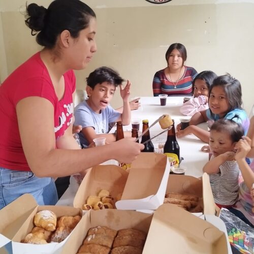 volunteer serving bread